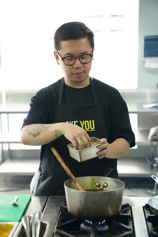 Chef Nicco Santos teaches his students how to innovate traditional dishes.JPG